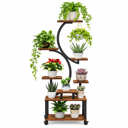 A freestanding curved multi-tier plant stand with brown wooden shelves and a black metal frame on casters, shown holding multiple potted green plants against a plain white background.