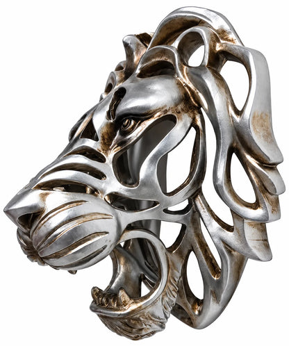 A silver-toned metal lion head sculpture with an openwork, filigree design and weathered bronze-brown patina highlights, shown on a plain white background.