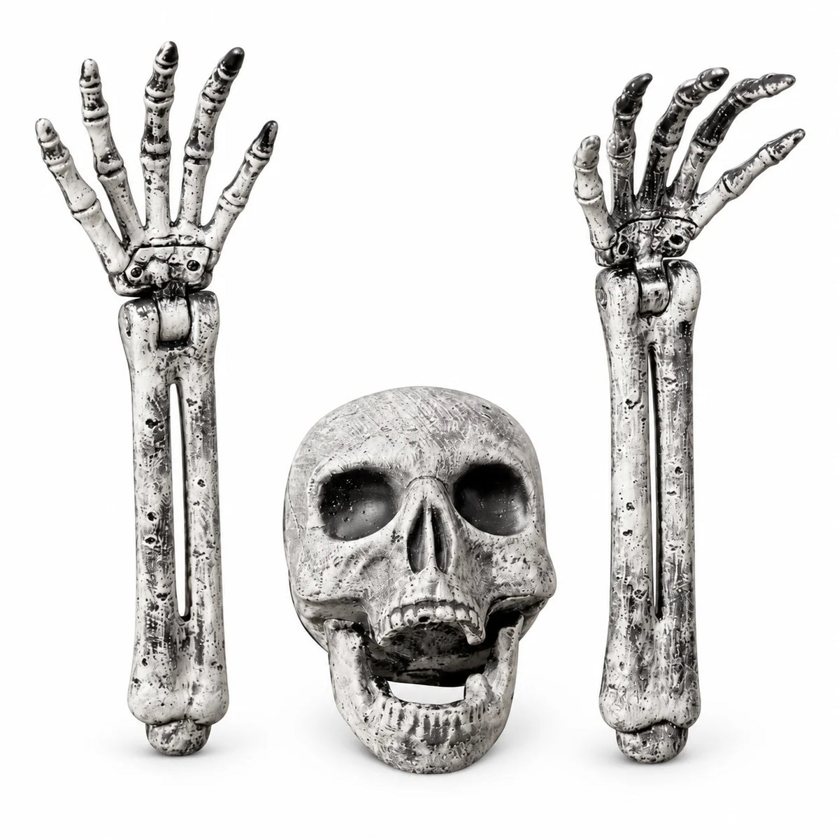 A Halloween decoration set featuring a realistic skull in the center, flanked by two raised skeleton hands and forearm bones, all shown on a plain white background.